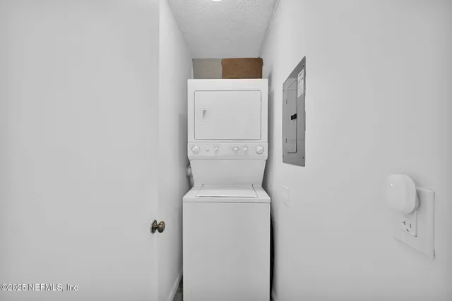 a living room with furniture large window and a flat screen tv