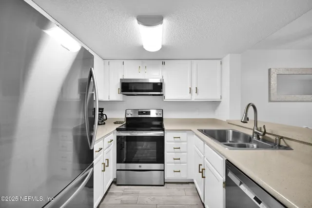 a bed room with couch and painting on the wall