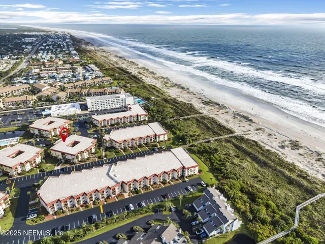 a living room with fireplace furniture and a wooden floor