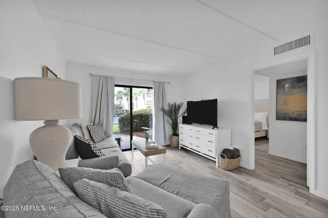 a bedroom with a bed and a ceiling fan