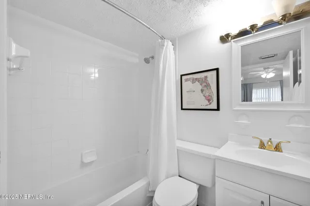 an aerial view of a house with a ocean view