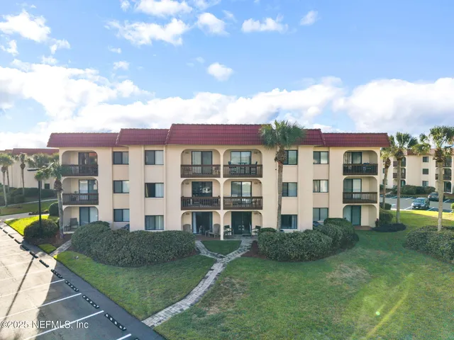 a view of a swimming pool with outdoor seating