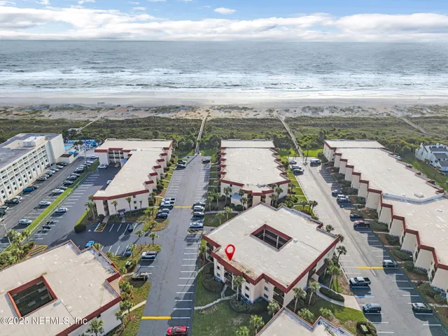 a view of a swimming pool with lawn chairs