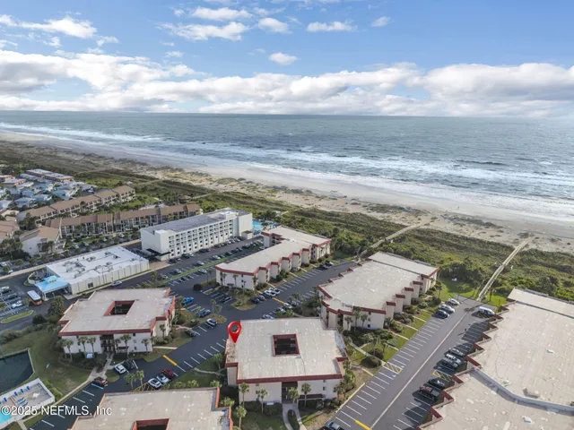 a view of yard with swimming pool and seating area