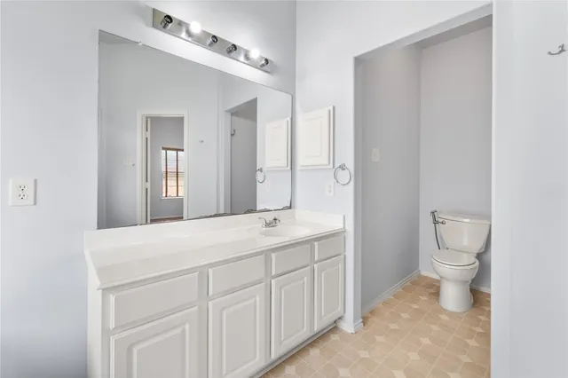 a bathroom with a bathtub sink and mirror