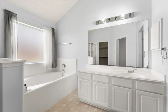 a view of an empty room with a ceiling fan