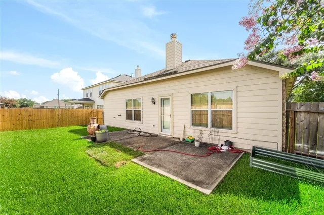 a view of a backyard with plants and a garden
