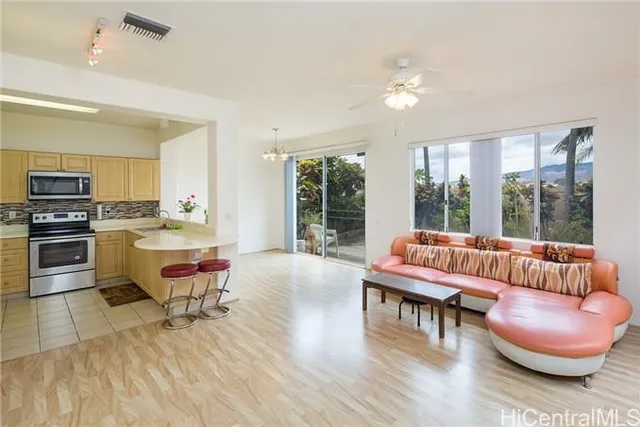 a living room with furniture and a large window