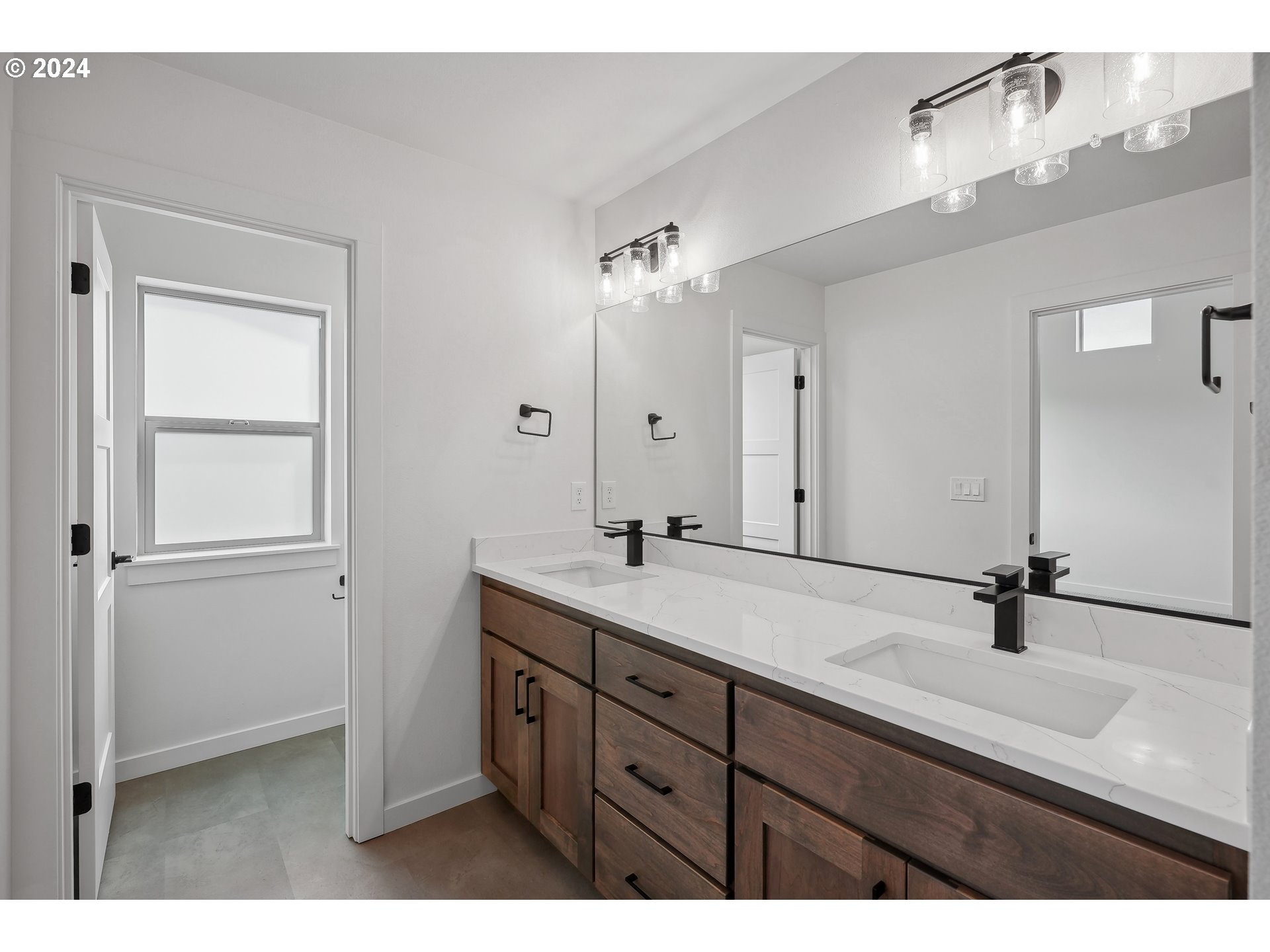 2541 South White Salmon Drive Ridgefield, WA 98642 - Photo 22 of 29 a bathroom with a sink vanity granite and a mirror