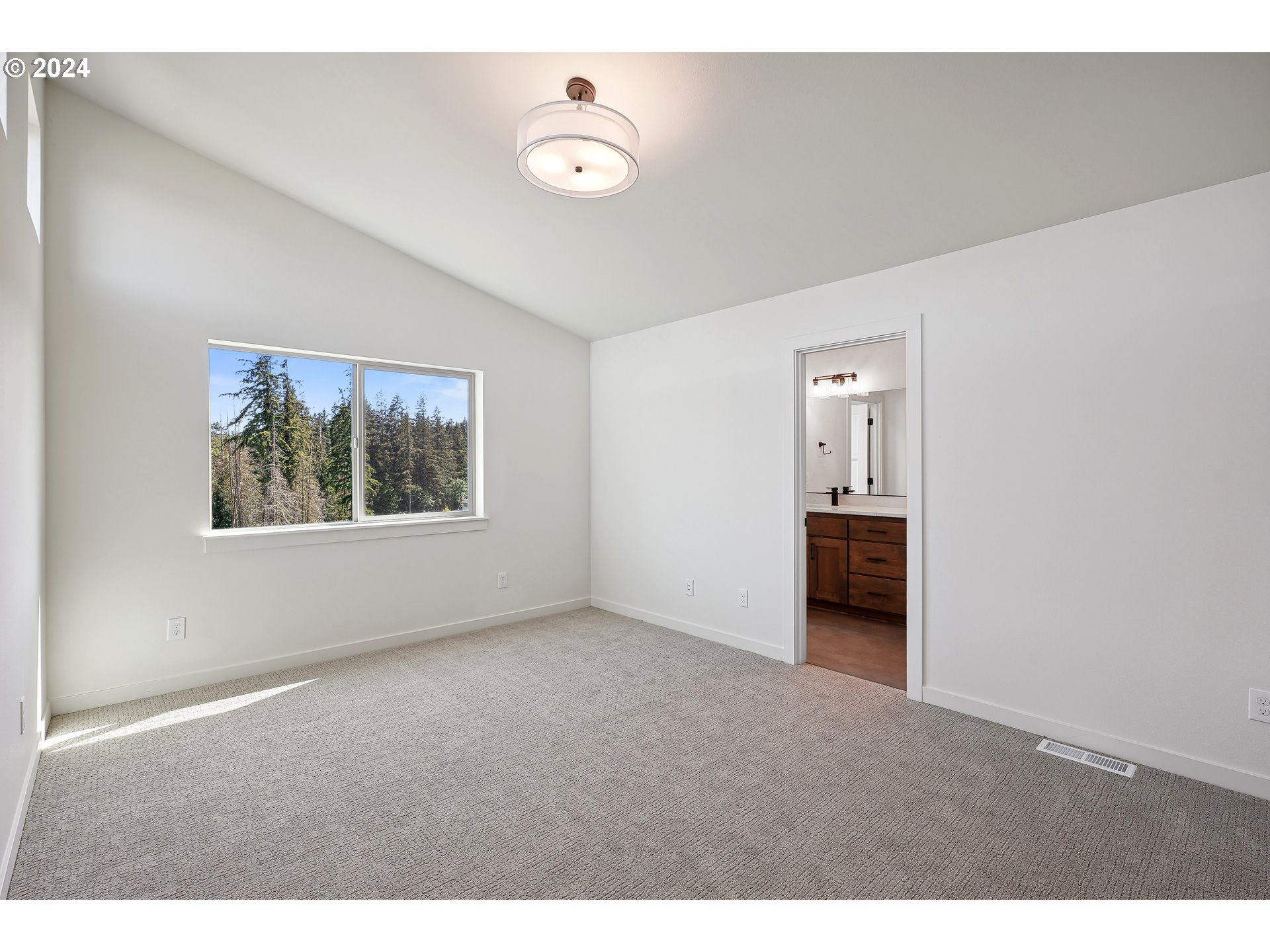 2541 South White Salmon Drive Ridgefield, WA 98642 - Photo 23 of 29 a view of an empty room with a window