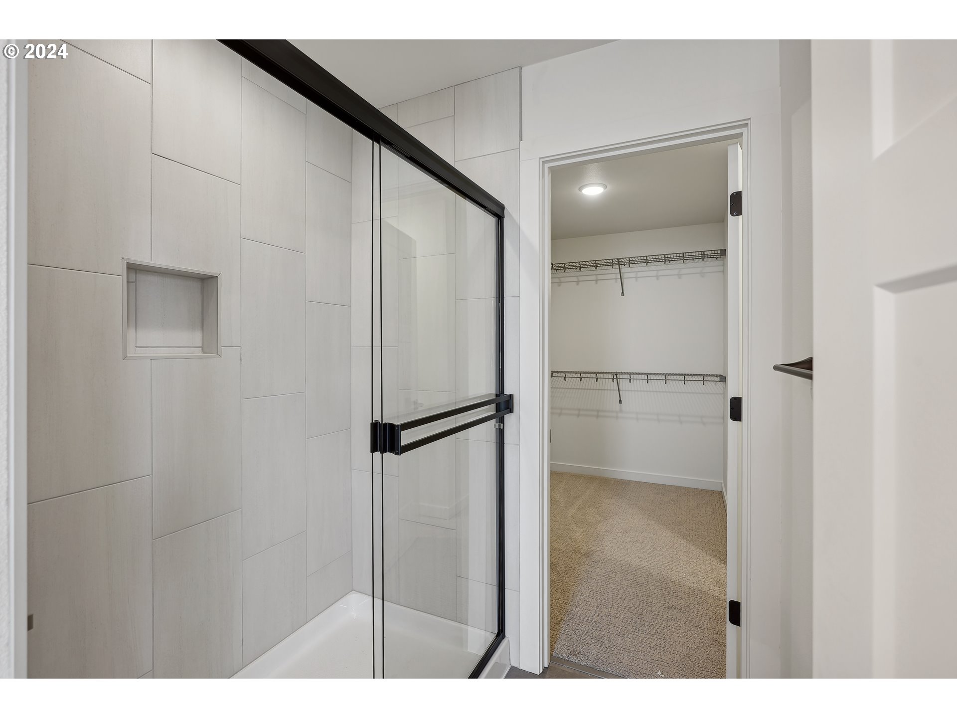 2541 South White Salmon Drive Ridgefield, WA 98642 - Photo 24 of 29 a bathroom with a glass shower door