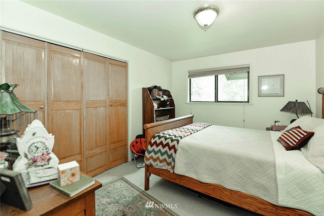 20431 Welch Road Snohomish, WA 98296 - Photo 12 of 25 a bedroom with a bed and window