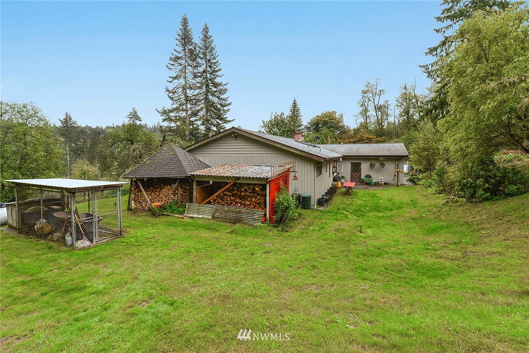 20431 Welch Road Snohomish, WA 98296 - Photo 17 of 25 a view of a house with backyard and garden
