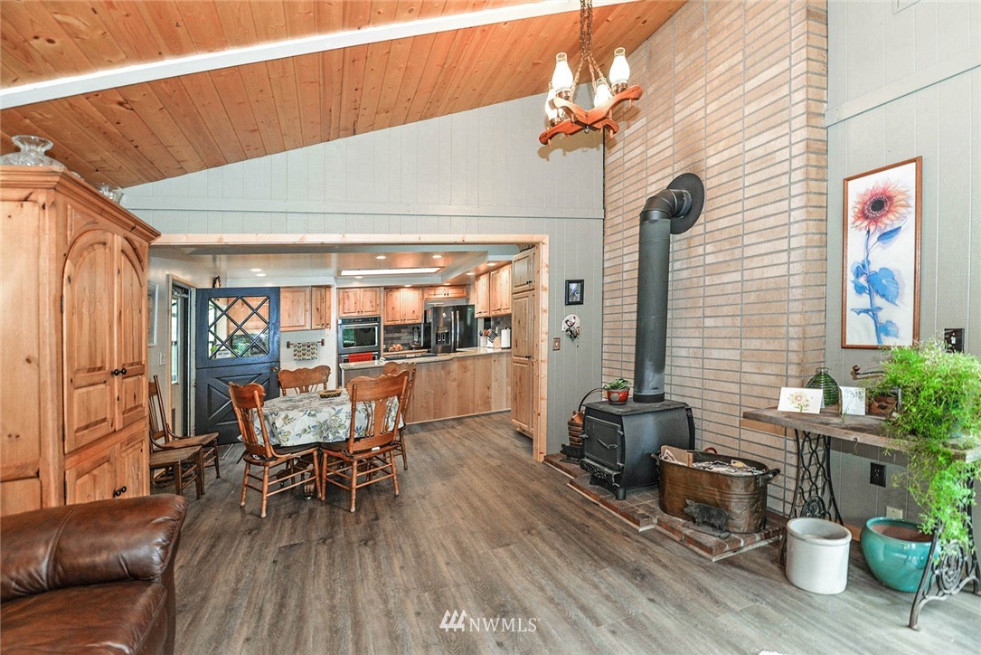 20431 Welch Road Snohomish, WA 98296 - Photo 5 of 25 a dining room with furniture and wooden floor
