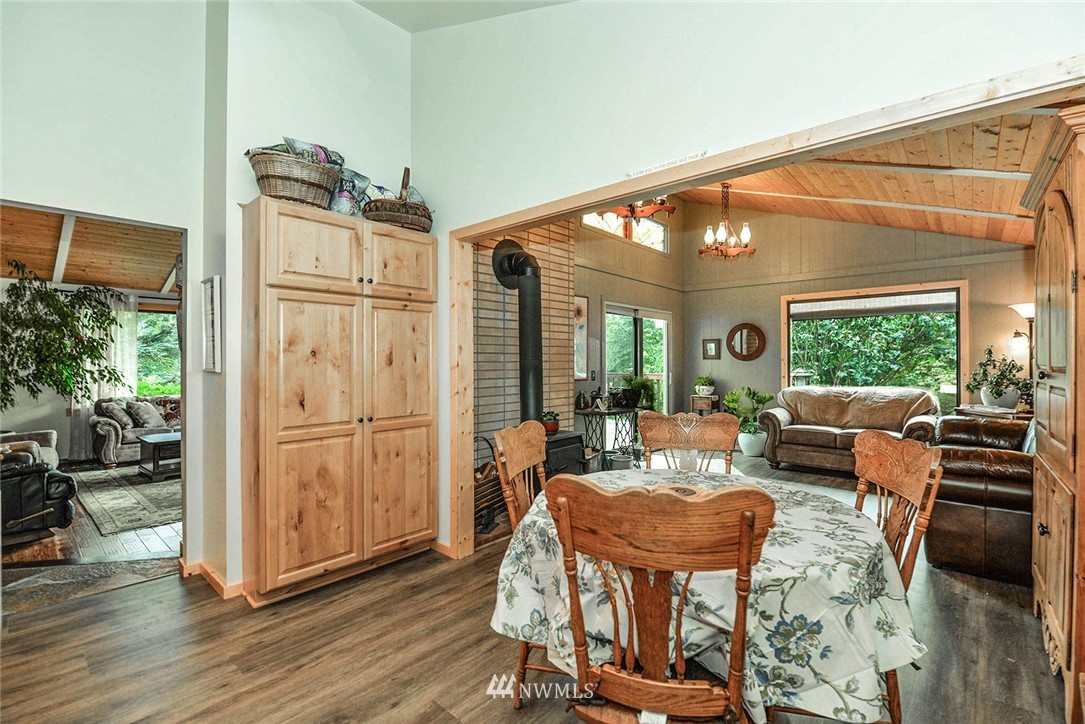 20431 Welch Road Snohomish, WA 98296 - Photo 8 of 25 a living room with furniture a large window and wooden floor
