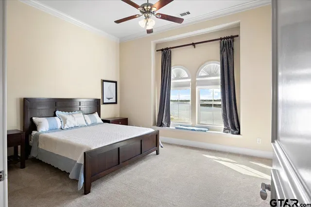 a bedroom with a bed and a view