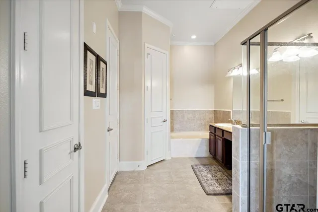 a view of storage and utility room with closet