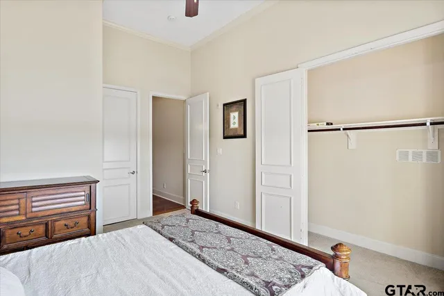 a bathroom with a granite countertop sink toilet a mirror a vanity and shower