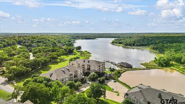 an aerial view of a house with a lake view