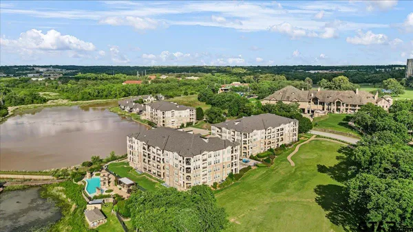 a view of a lake with a city