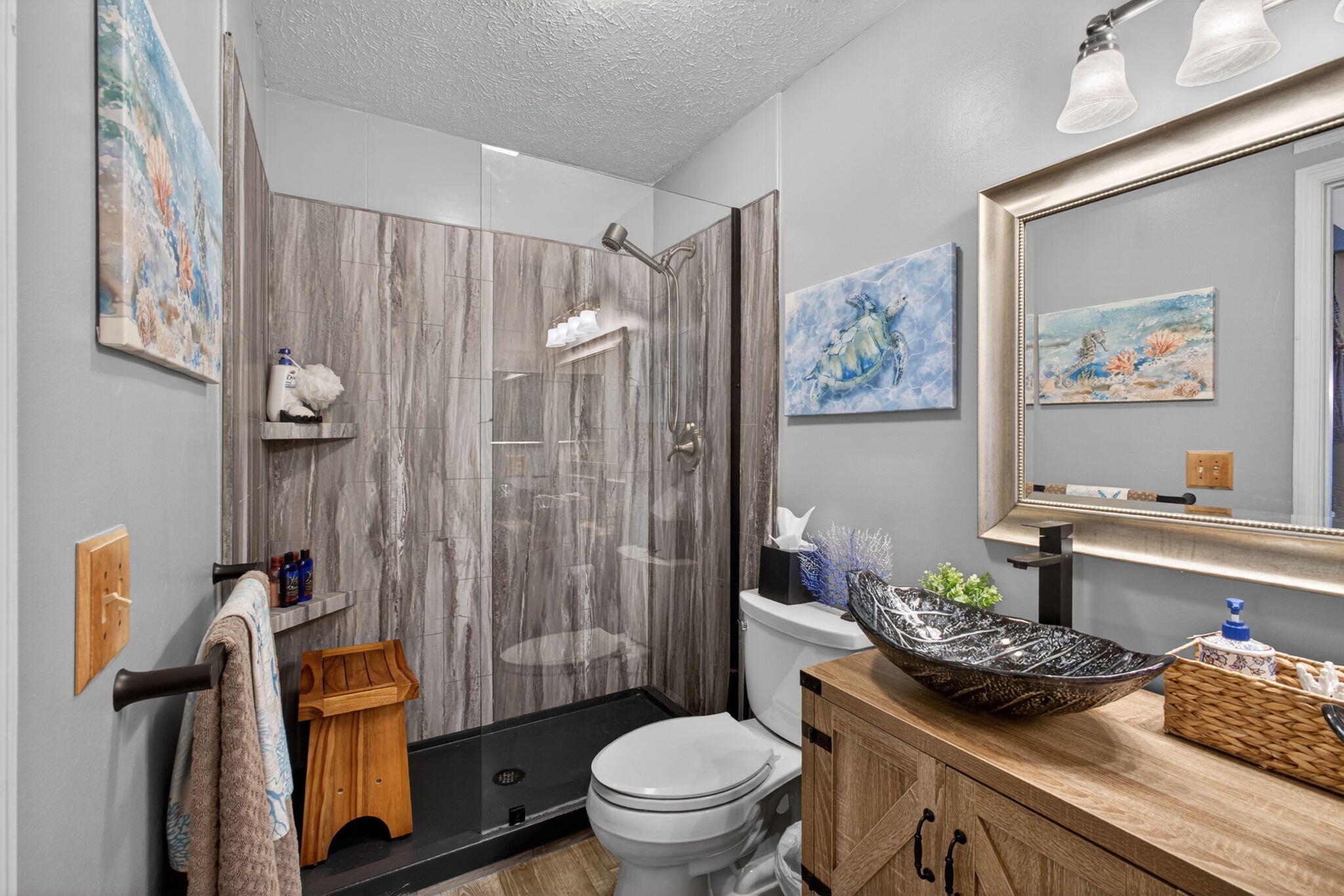 12558 165th Road North Jupiter, FL 33478 - Photo 29 of 67 a bath room with a toilet and a shower curtain