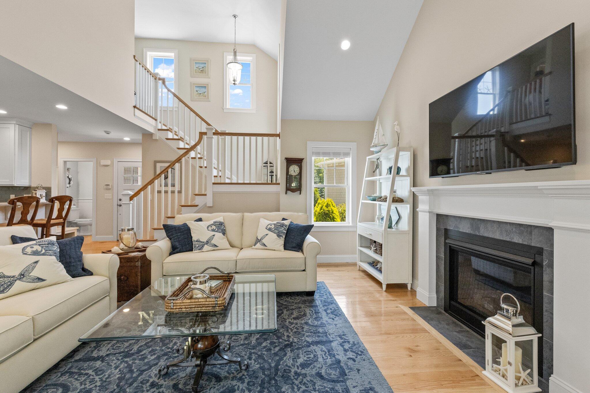 22 Saltwater Circle Mashpee, MA 02649 - Photo 11 of 53 a living room with furniture fireplace and flat screen tv