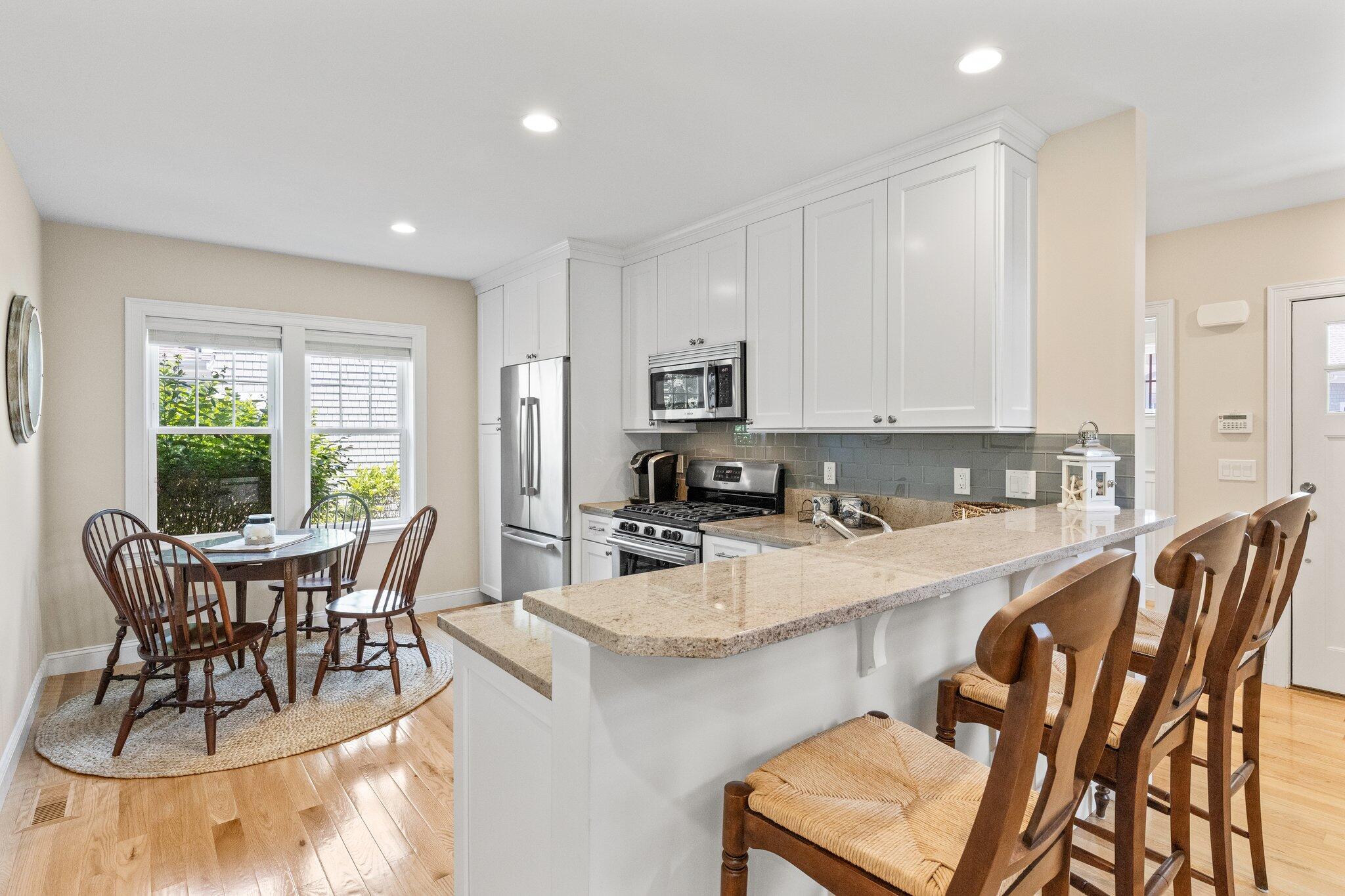 22 Saltwater Circle Mashpee, MA 02649 - Photo 13 of 53 a view of kitchen with cabinets table and chairs