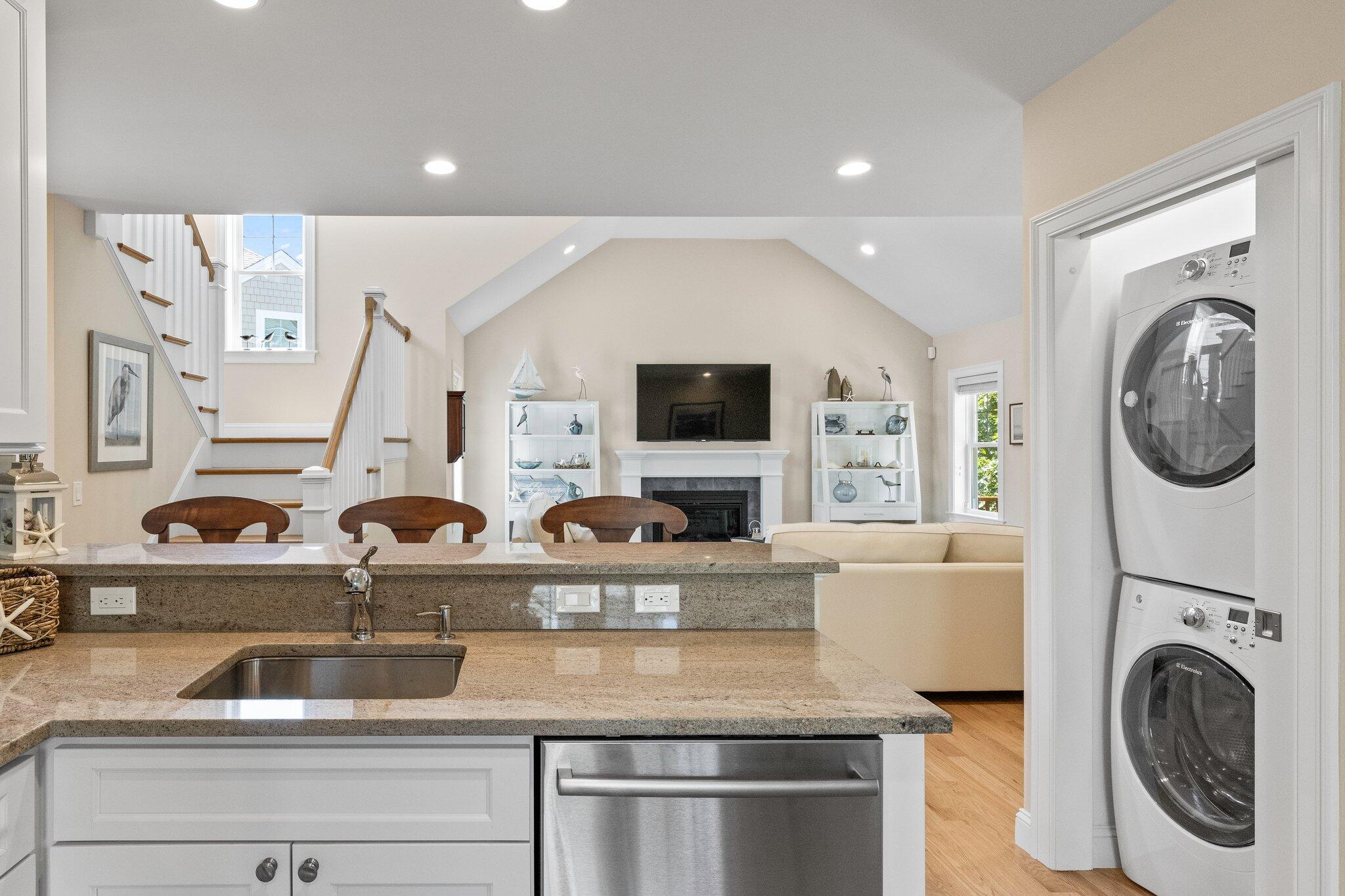 22 Saltwater Circle Mashpee, MA 02649 - Photo 16 of 53 a kitchen with a sink a stove and a microwave