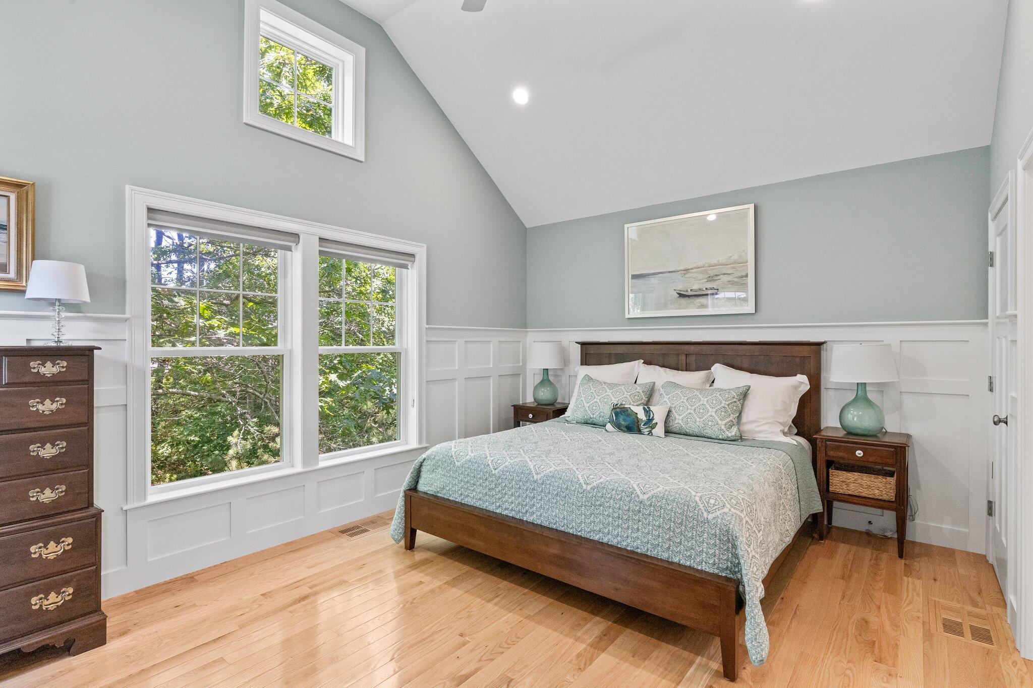 22 Saltwater Circle Mashpee, MA 02649 - Photo 18 of 53 a bedroom with a bed and a dresser next to a window