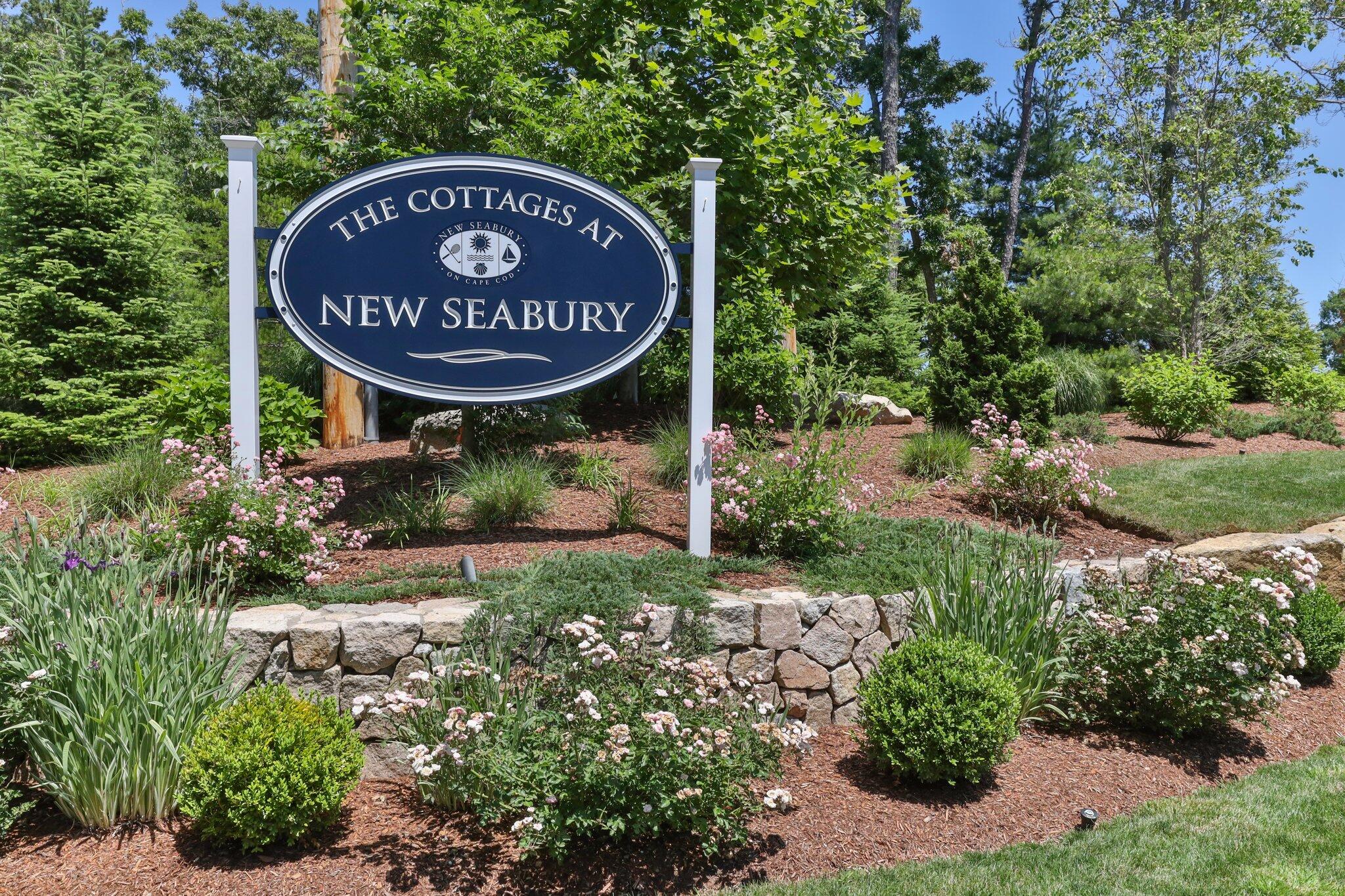 22 Saltwater Circle Mashpee, MA 02649 - Photo 2 of 53 a sign on the side of a building