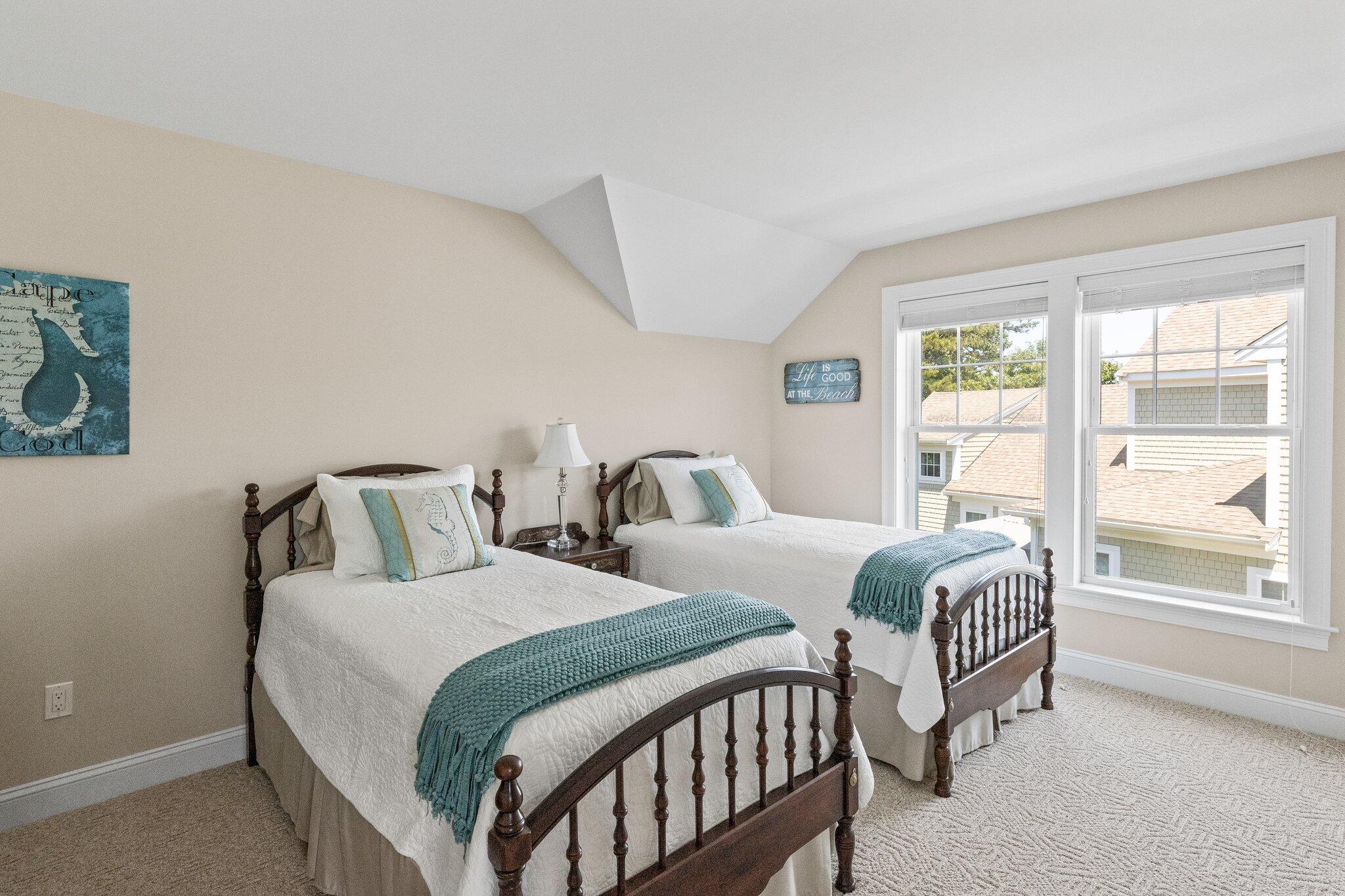 22 Saltwater Circle Mashpee, MA 02649 - Photo 23 of 53 a bedroom with two beds and a large window