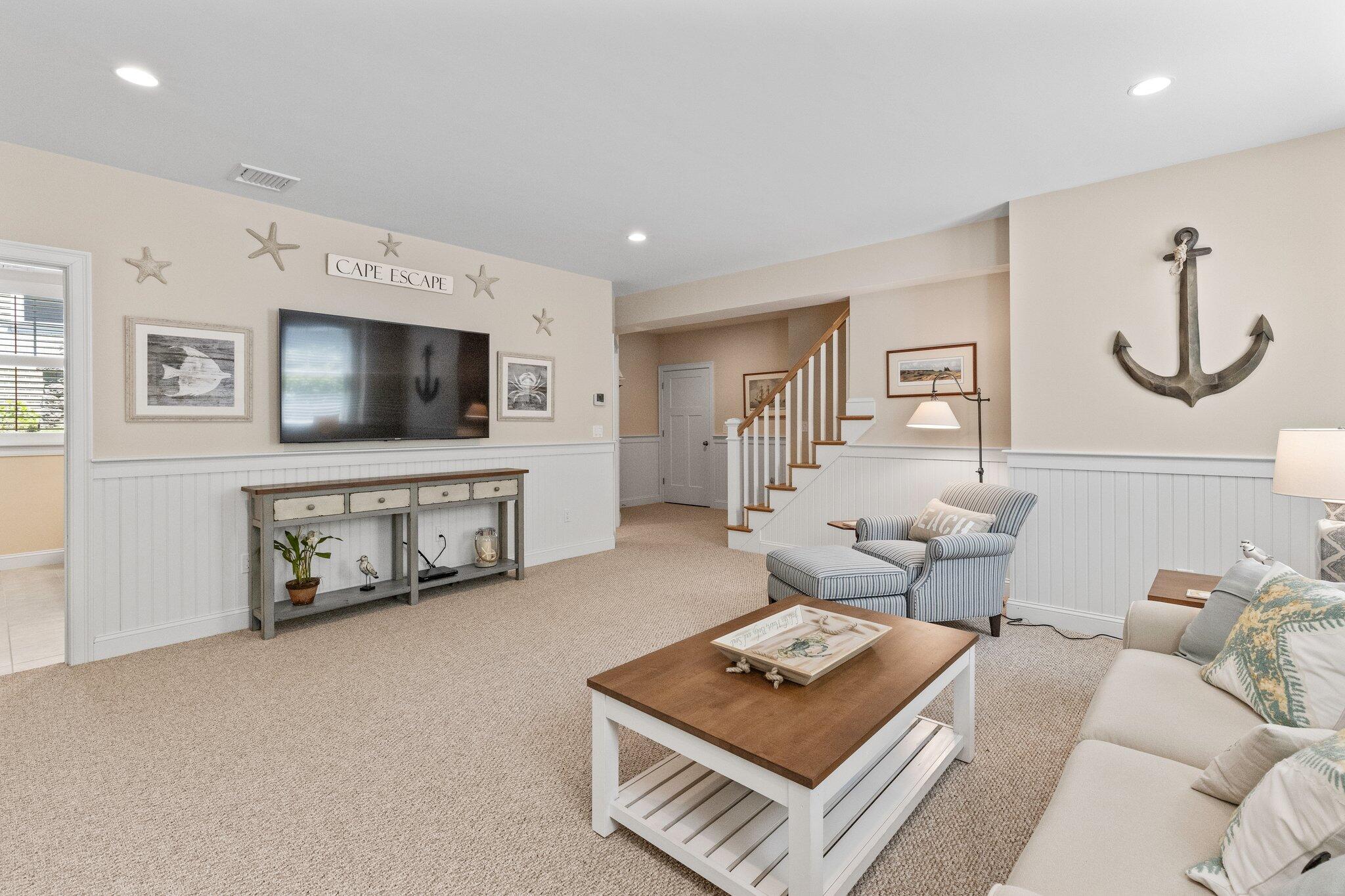 22 Saltwater Circle Mashpee, MA 02649 - Photo 28 of 53 a living room with furniture and a flat screen tv
