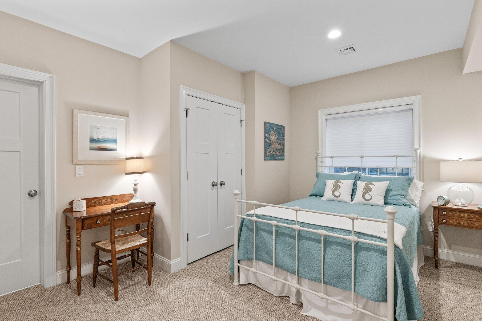 22 Saltwater Circle Mashpee, MA 02649 - Photo 29 of 53 a bedroom with a bed and a chair