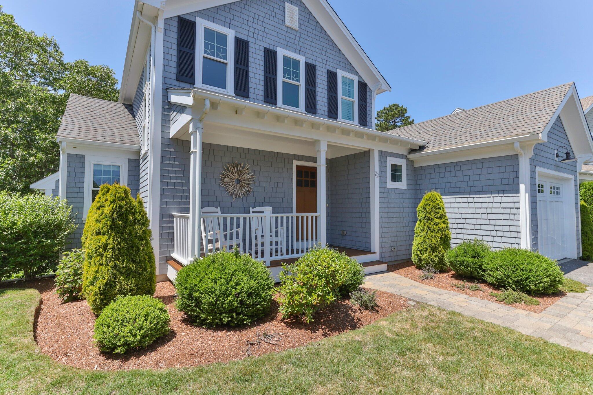 22 Saltwater Circle Mashpee, MA 02649 - Photo 3 of 53 a front view of a house with garden