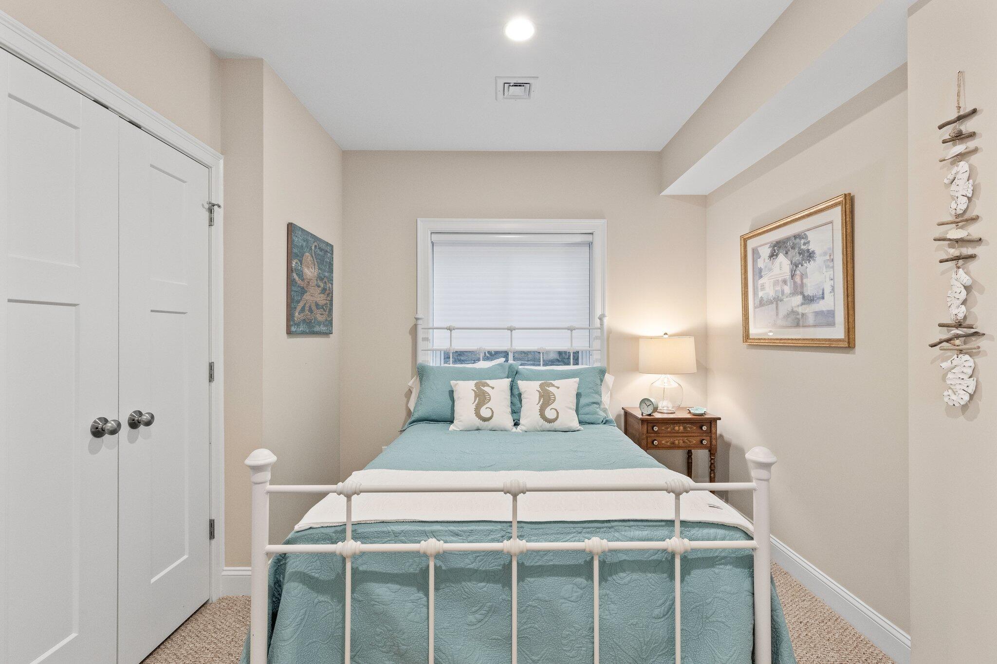 22 Saltwater Circle Mashpee, MA 02649 - Photo 31 of 53 a bedroom with a bed and a window