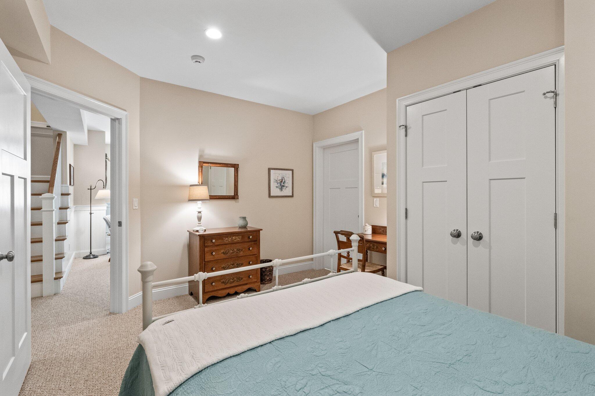 22 Saltwater Circle Mashpee, MA 02649 - Photo 32 of 53 a bedroom with furniture and a mirror