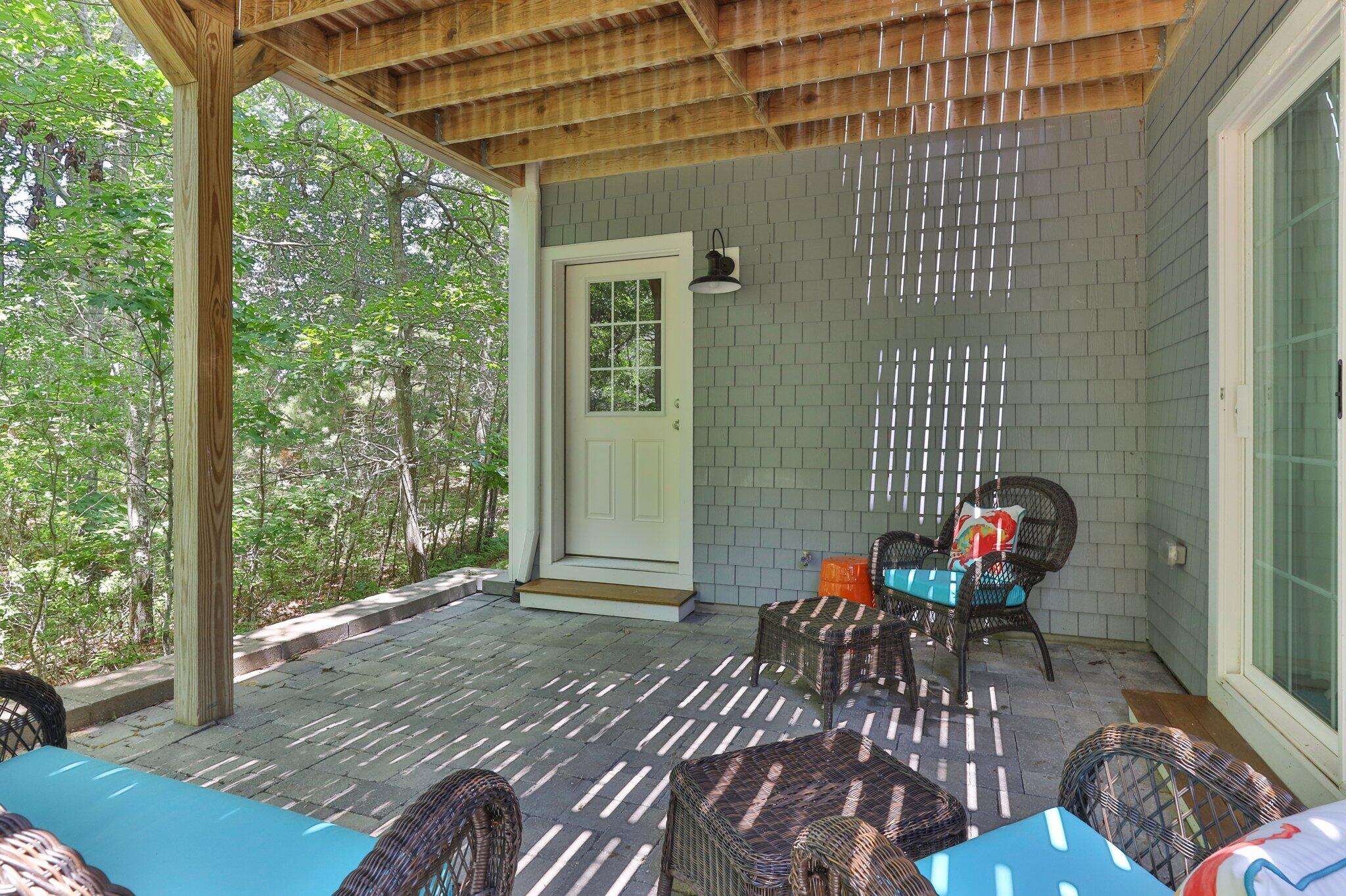 22 Saltwater Circle Mashpee, MA 02649 - Photo 34 of 53 a backyard of a house with seating space