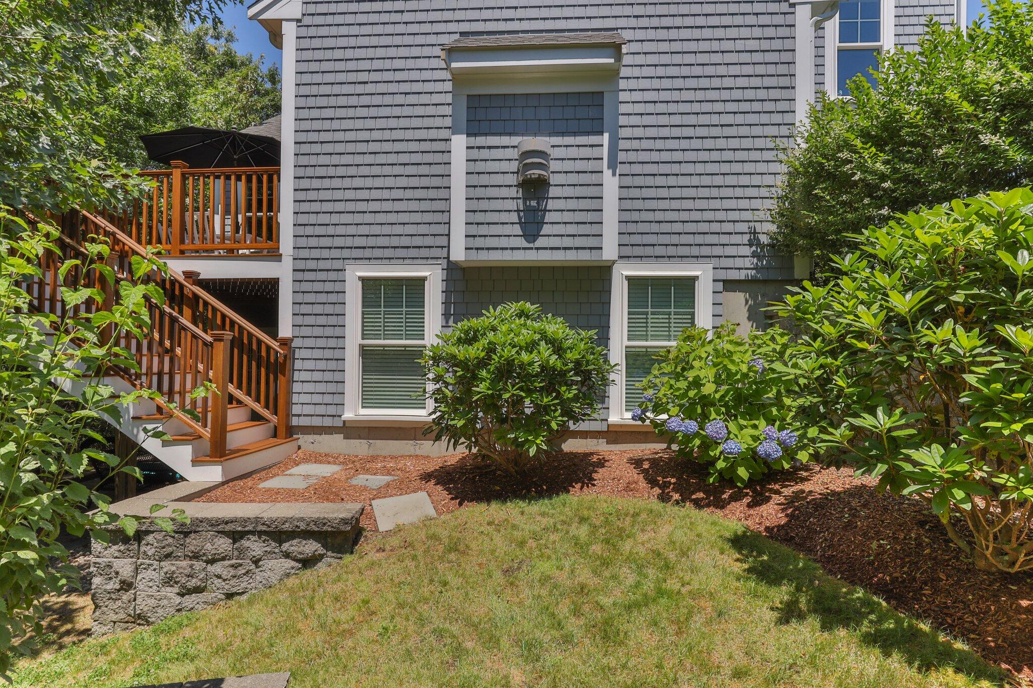 22 Saltwater Circle Mashpee, MA 02649 - Photo 35 of 53 a view of a house with potted plants