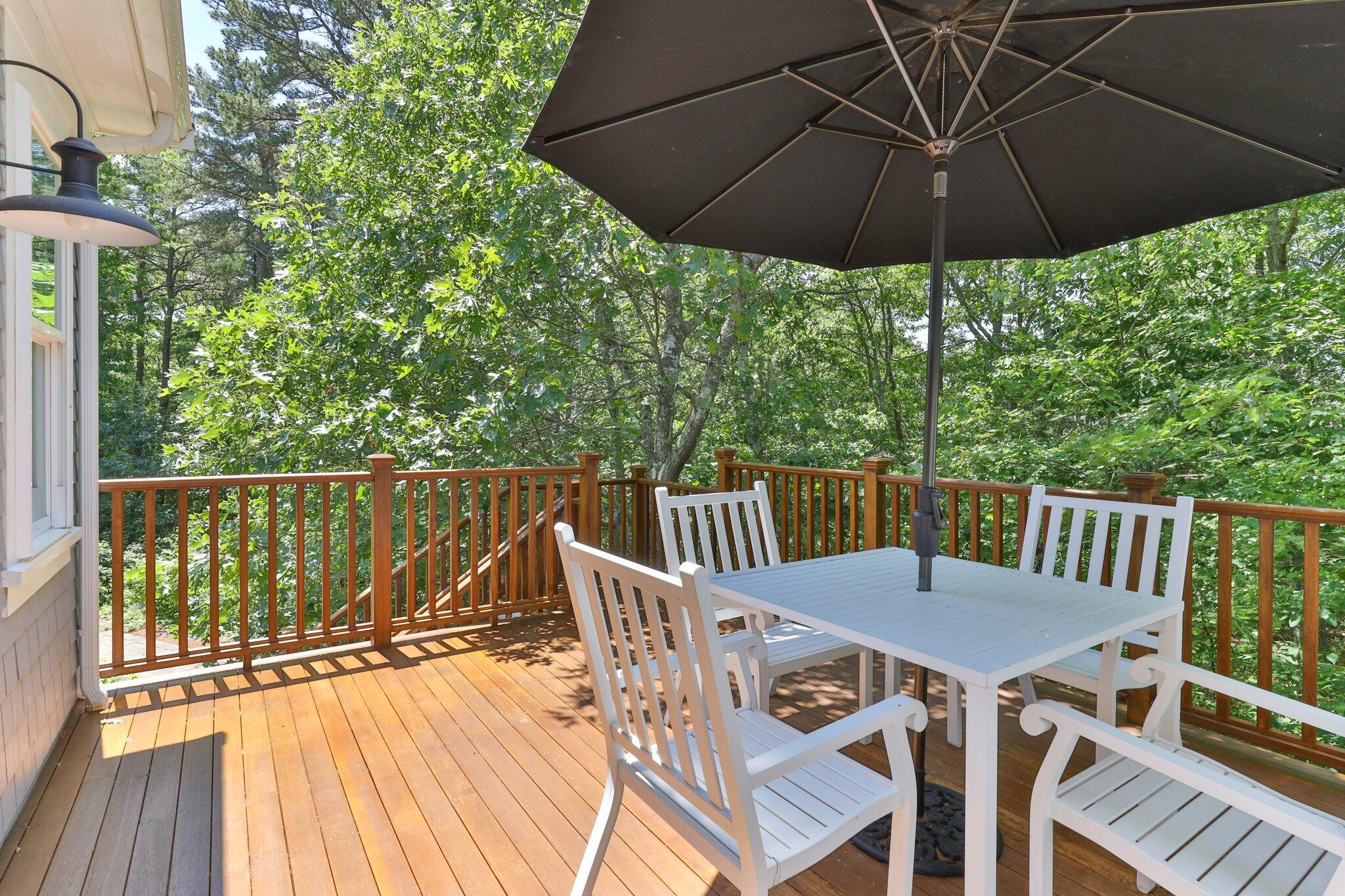 22 Saltwater Circle Mashpee, MA 02649 - Photo 37 of 53 a view of balcony with furniture and umbrella