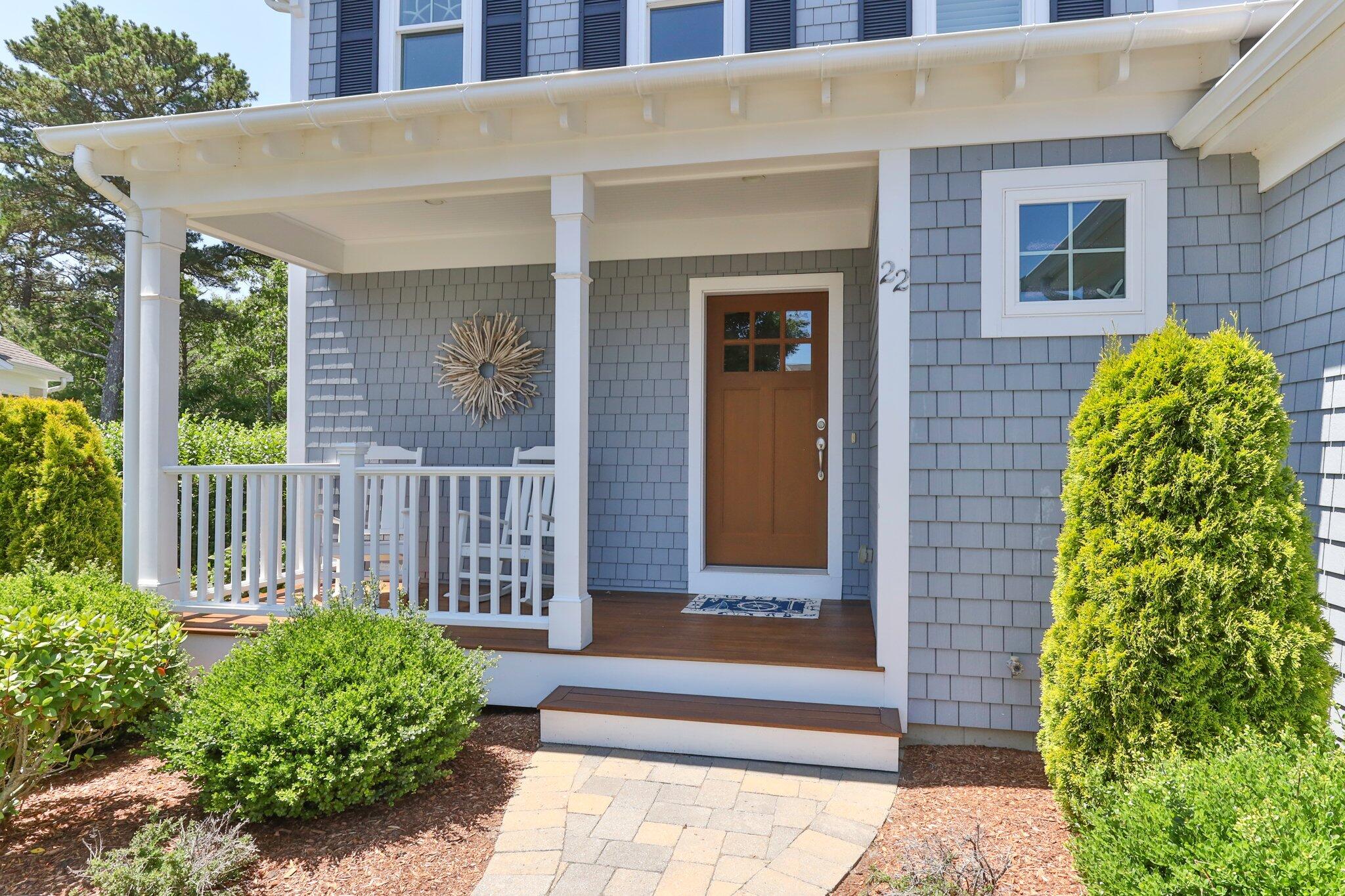 22 Saltwater Circle Mashpee, MA 02649 - Photo 4 of 53 a view of a house with a small yard and plants
