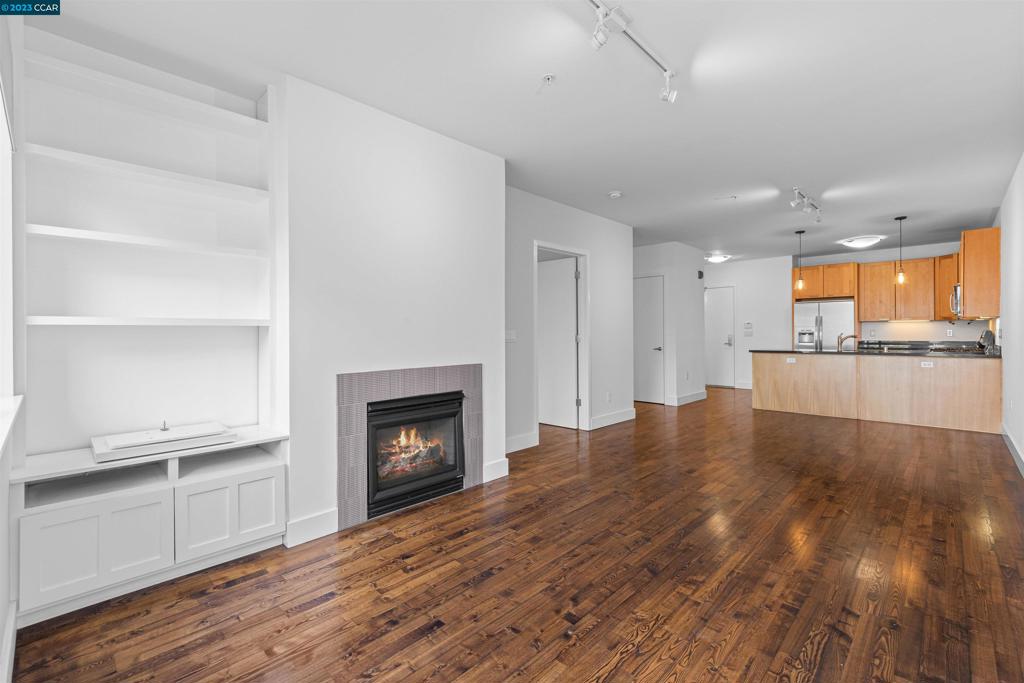 2300 Broadway Oakland, CA 94612 - Photo 3 of 32 a view of kitchen with granite countertop cabinets and fireplace