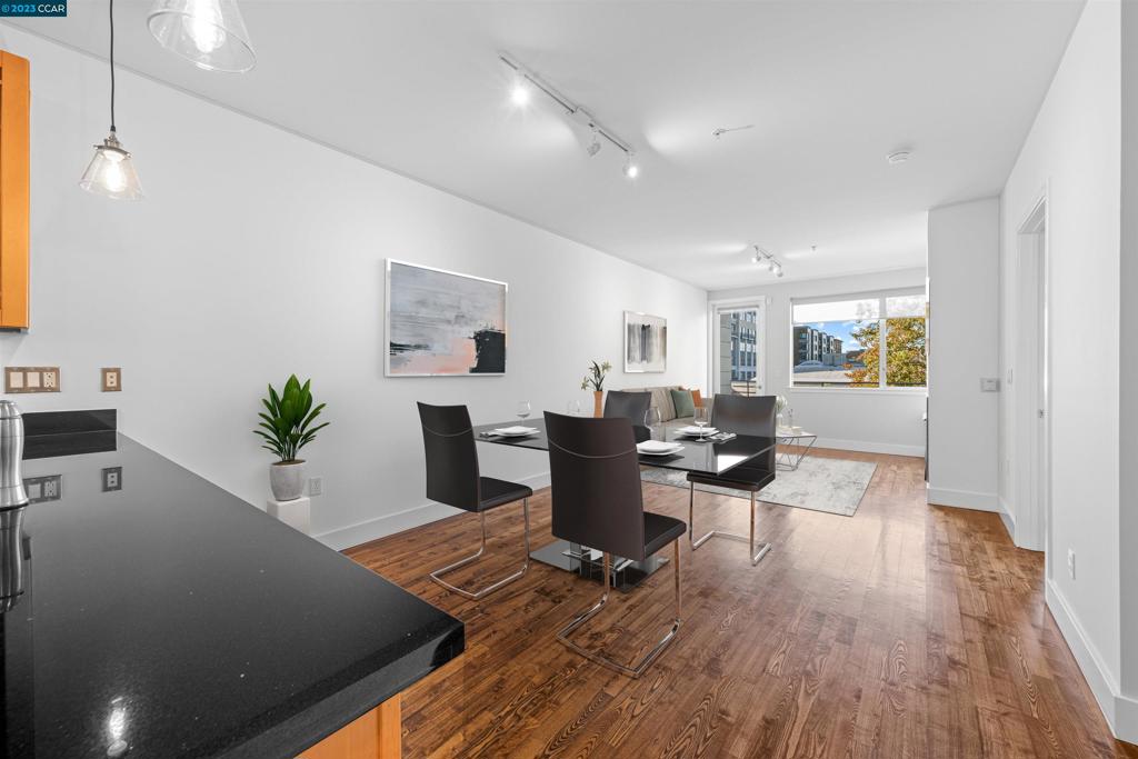 2300 Broadway Oakland, CA 94612 - Photo 5 of 32 a living room with furniture and wooden floor