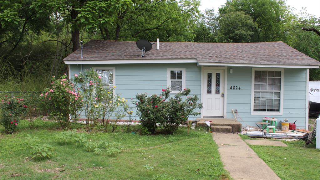 4624 Burma Road Dallas, TX 75216 - Photo 1 of 1 Ranch-style house with a shingled roof and a front lawn