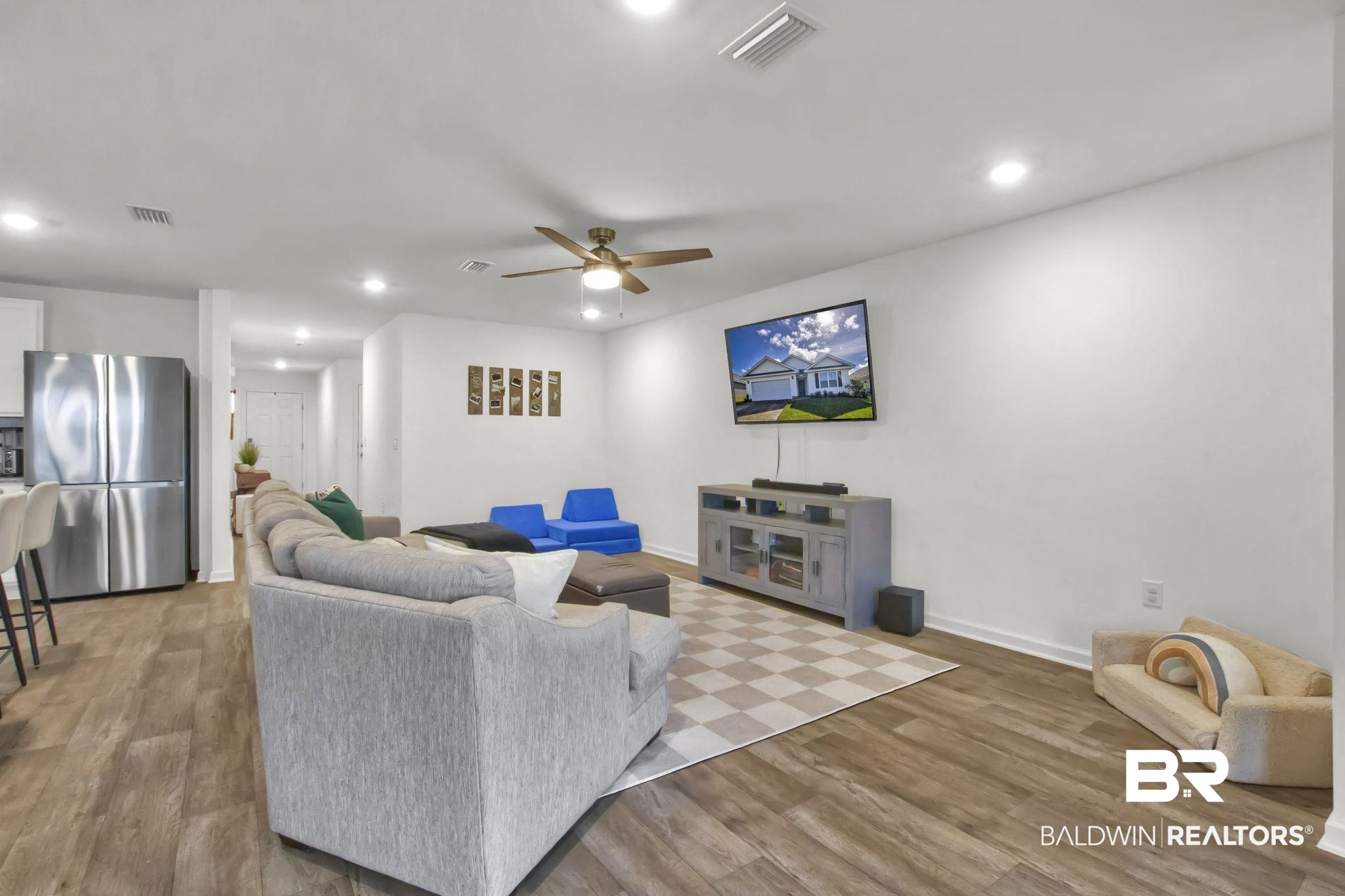 23810 Unbridled Loop Daphne, AL 36526 - Photo 6 of 50 Living room featuring ceiling fan and hardwood / wood-style floors