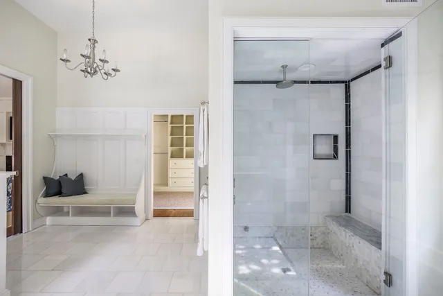 a view of a bathroom with a tub and shower