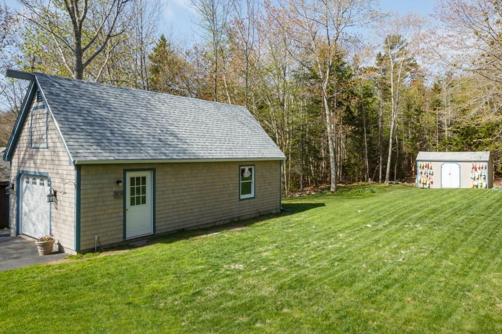 8 Hackelton Road Chamberlain, ME 04541 - Photo 22 of 28 Garage with Garden Shed and Backyard