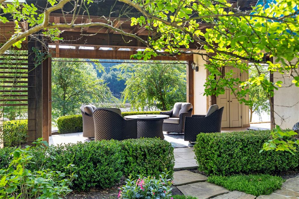 3920 Smelley Road Longview, TX 75605 - Photo 4 of 35 a view of a patio with table and chairs potted plants