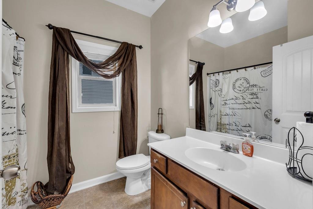 126 Meadow's Walk Drive Byron, GA 31008 - Photo 10 of 37 a bathroom with a sink a toilet and a mirror