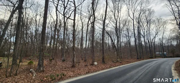 an aerial view of residential house with outdoor space and lake view