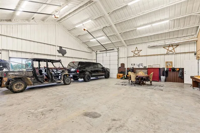a view of parking garage with cars